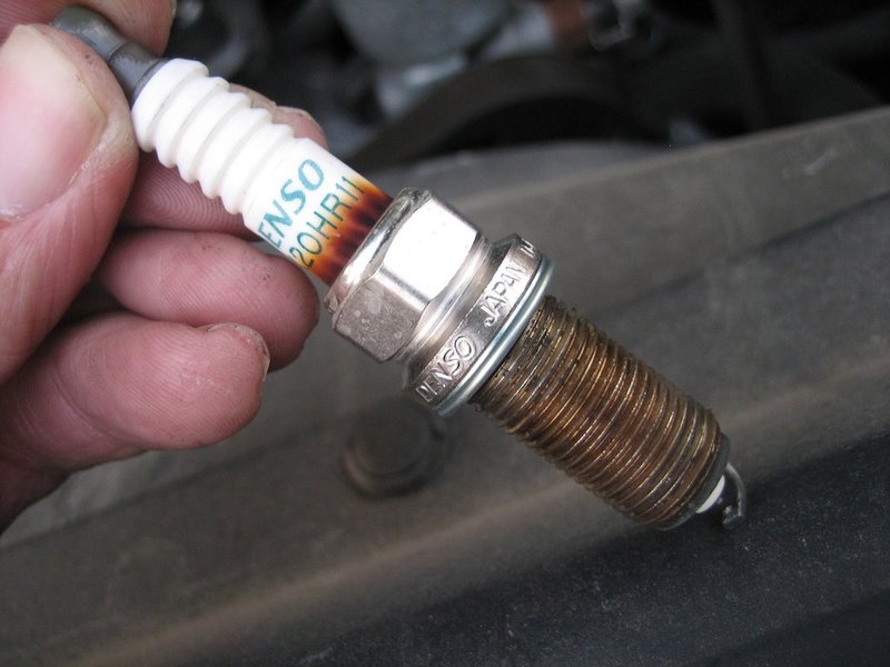 used spark plug (pulled_plug.jpg) World